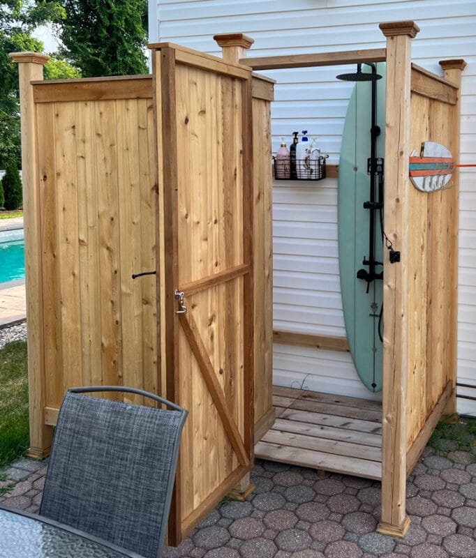 outdoor showers enclosure with surfboard