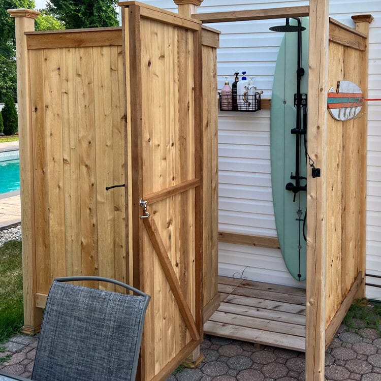 outdoor showers enclosure with surfboard