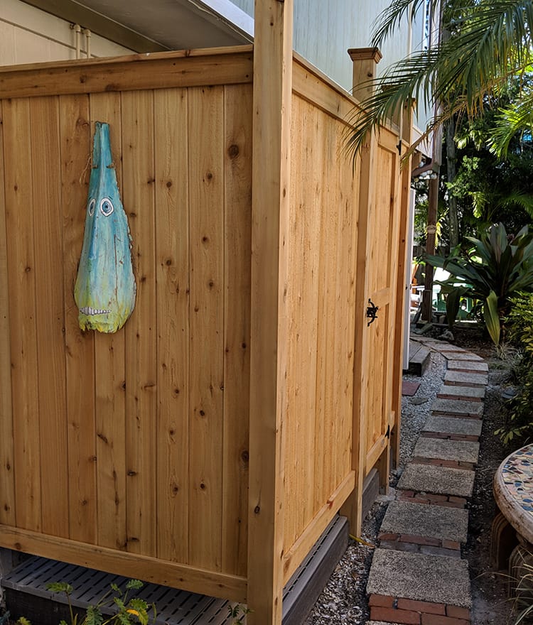 outdoor showers cedar in florida against back of house
