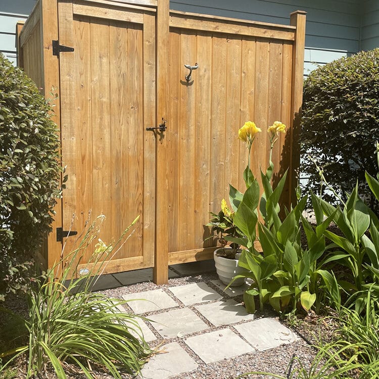 shower stall kit cedar against a house