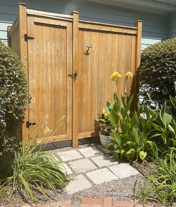 shower stall kit cedar against a house