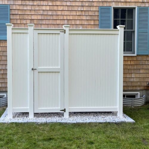 diy shower outdoor changing room against shingled home