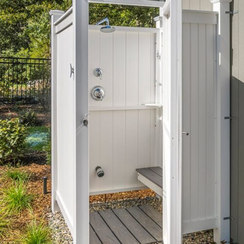 vinyl outdoor shower near pool house