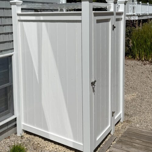 boardwalk leading to outdoor shower enclosure