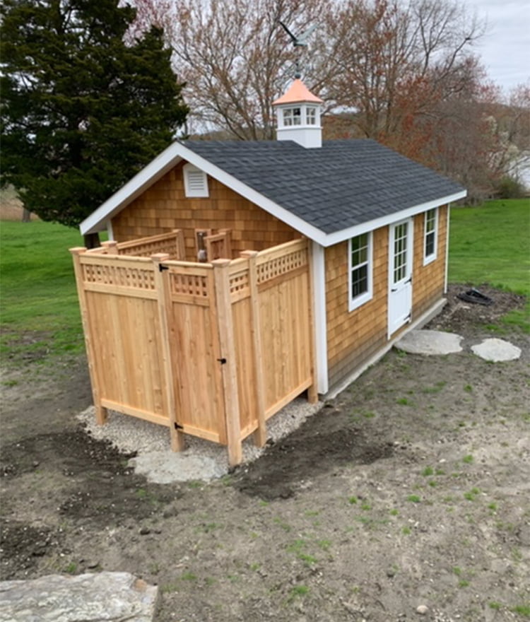 wood house mounted outside shower stall