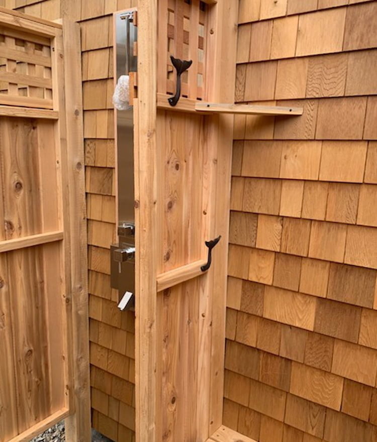 cedar outdoor shower panels against house