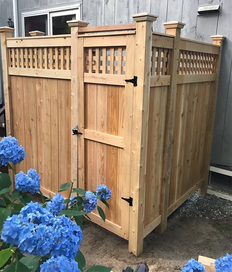 cedar outdoor shower enclosure with lattice panels