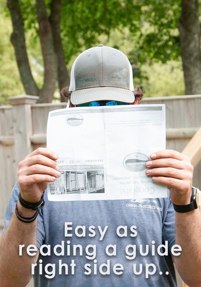 looking at instructions for shower stall assembly