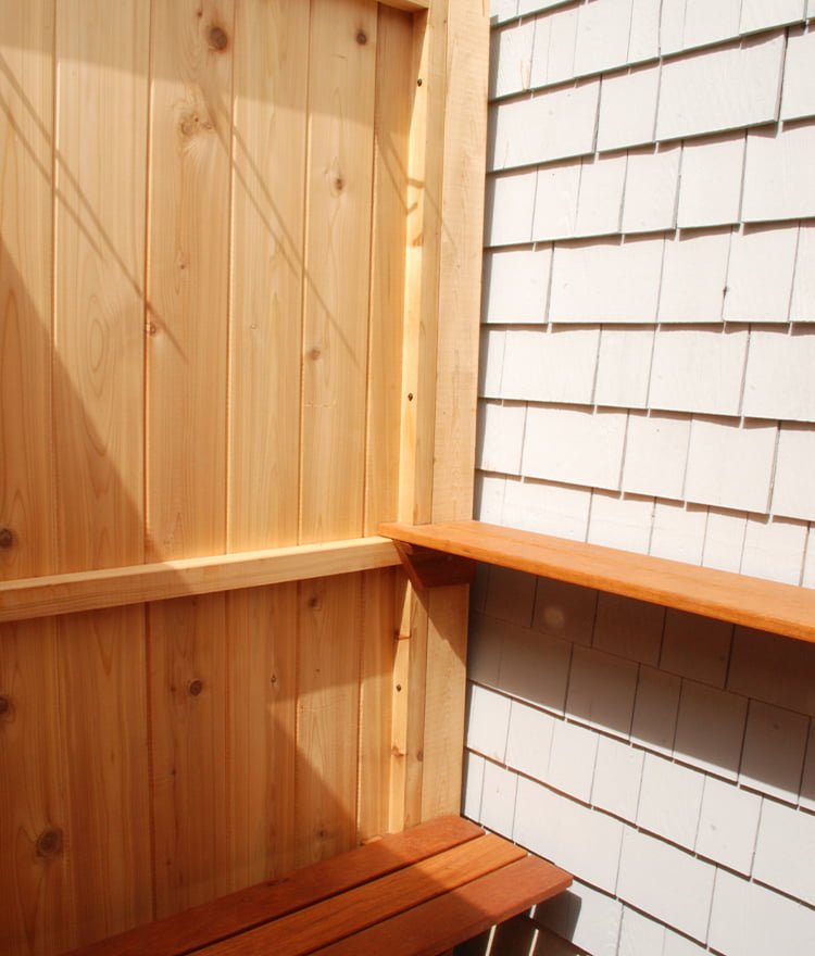 wood deluxe outdoor shower enclosure with a bench