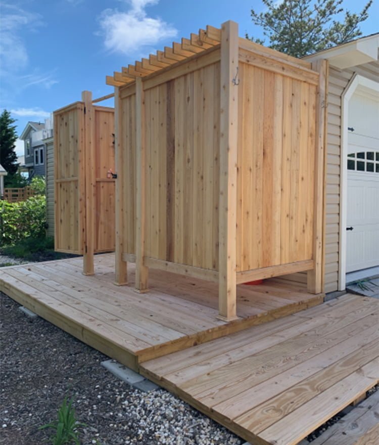deluxe shower enclosure kit against house