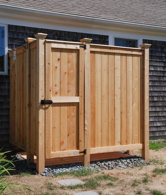cedar outside shower stall against the house