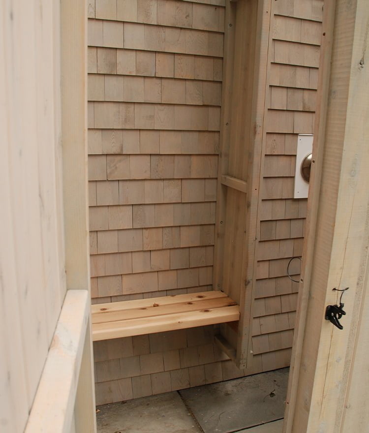 outdoor shower enclosure with bench