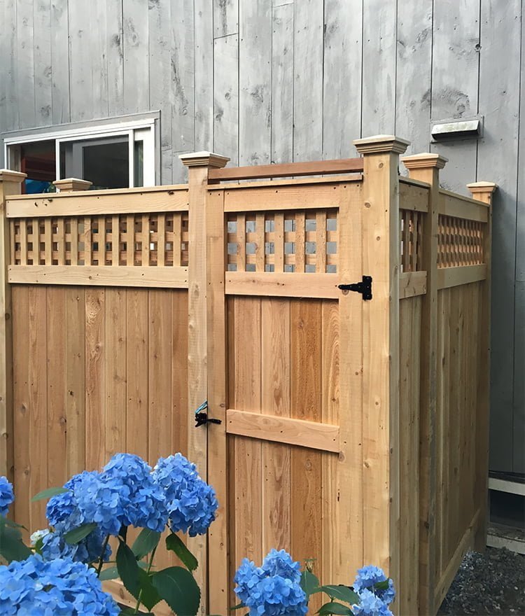 wood outdoor shower with lattice panels