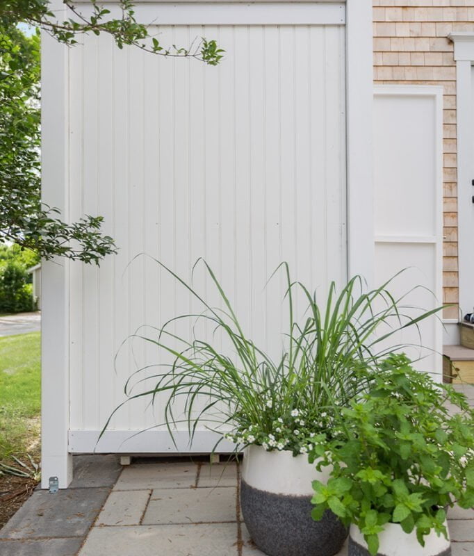 pvc garden shower deluxe against the house