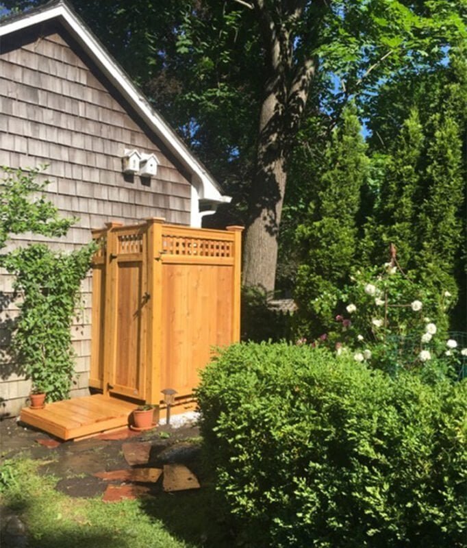 wood standard outdoor shower in the garden