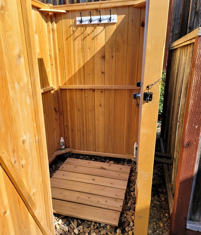cedar outdoor shower enclosure with hooks