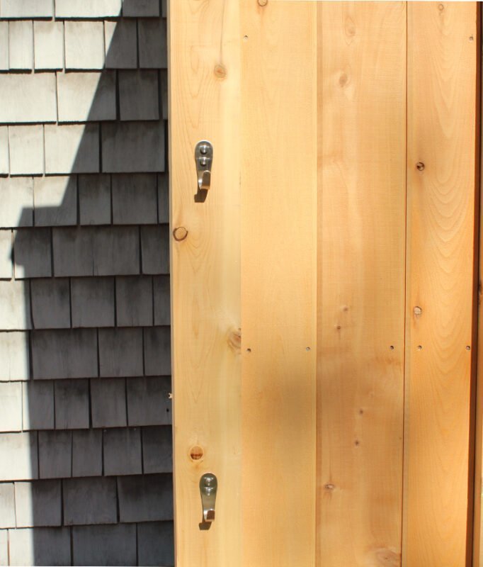 wood outdoor shower against the house