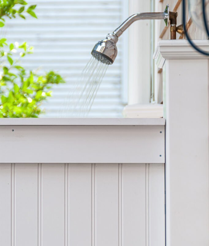 outdoor shower fixtures against the house