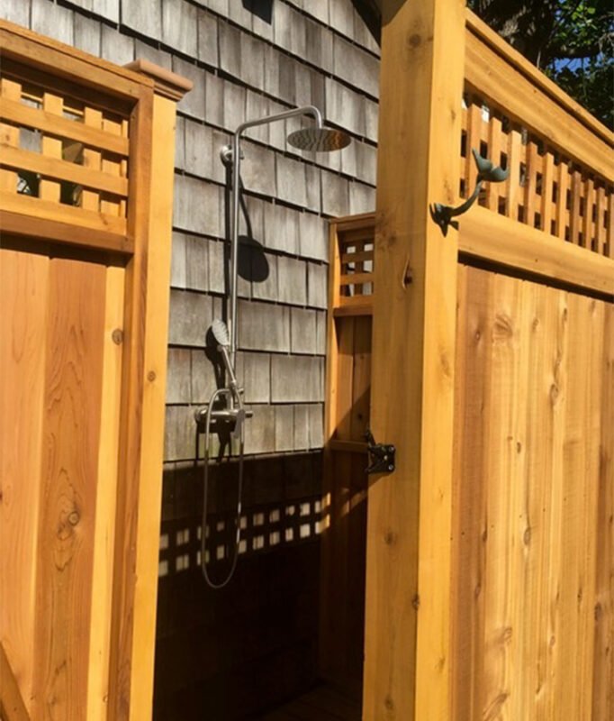 backyard shower house mount with lattice panels