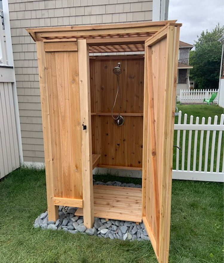 freestanding shower with wood lattice roof